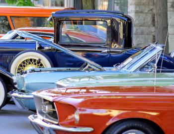 classic cars lined up on display outside 