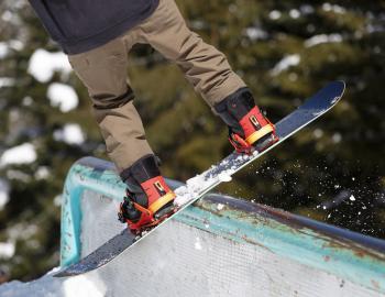 snowboarder riding a rail
