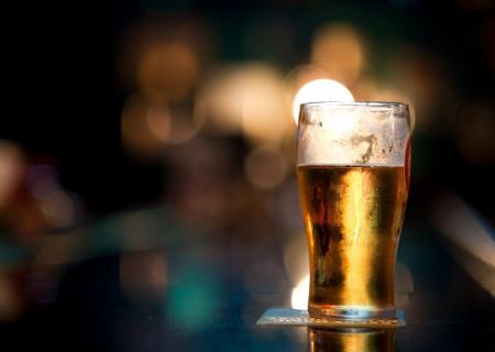 glass of beer with a blurry background