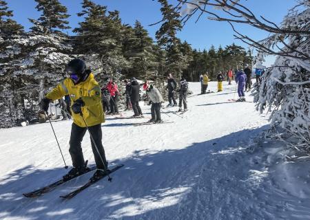 large group of people skiing together 